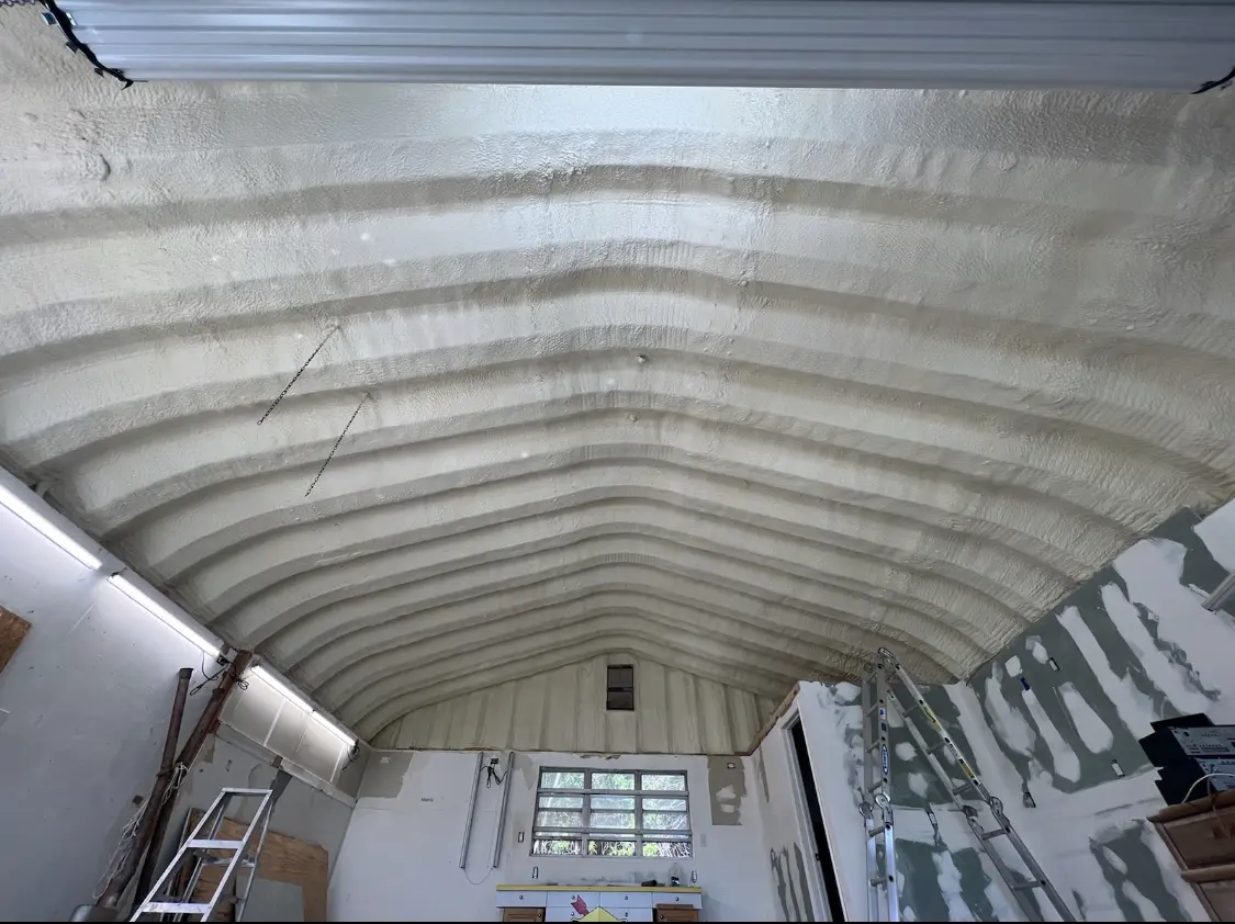 Spray polyurethane foam applied to the underside of a metal roof deck in East Haddam